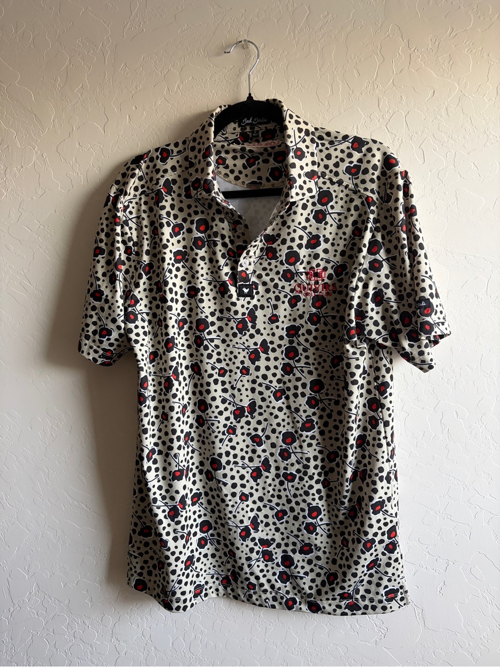 Bad Birdie Beige Polo with Black Spots and Red Accents